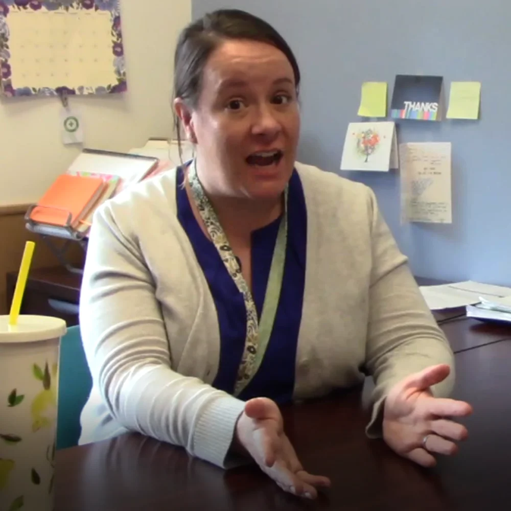 A high school student speaking directly to camera in a classroom setting — a still from the motivational video produced for the study